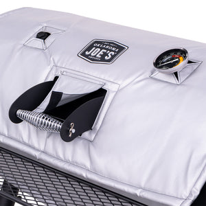 Black Weber charcoal kettle grill with a thermometer. It has a handle and wire rack.