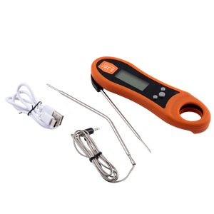 Orange meat thermometer with a probe. Includes a hanging cord.