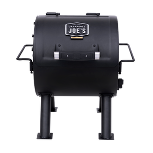 Black Weber Genesis gas grill with stainless steel accents. It has a control panel and burners.