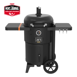 Black Weber Summit charcoal grill with side burner. Stainless steel construction. Includes wheels and prep space.