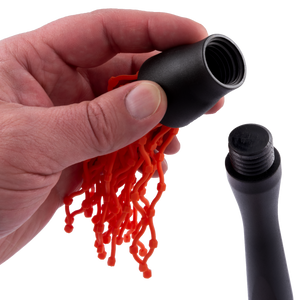 Orange silicone basting brush. It has a black handle. Perfect for grilling and cooking.