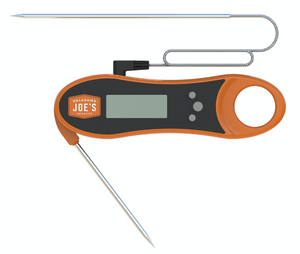 Orange and black digital meat thermometer. It has a stainless steel probe.