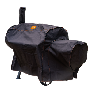 Black grill cover with red trim. Protects outdoor grills from weather. Durable and waterproof material.