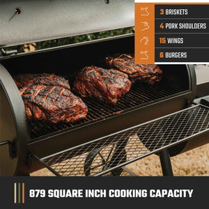 Black Weber gas grill with stainless steel accents. It sits on a patio.