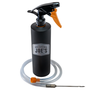 Black pressure sprayer with hose. Ideal for garden or cleaning use.
