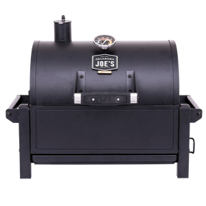 Black Weber Genesis E-310 gas grill. Stainless steel accents. Three burners. Control knobs visible.