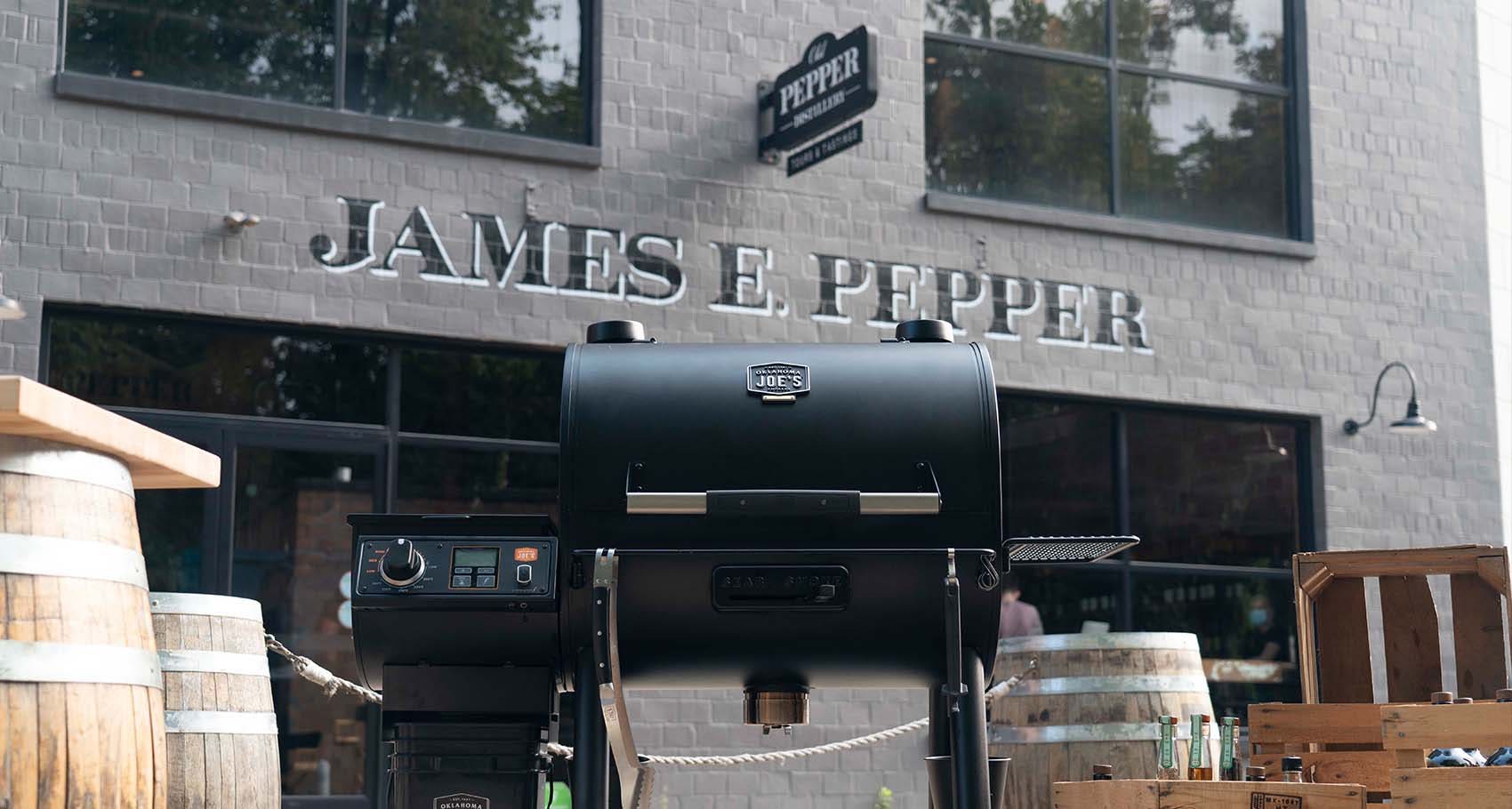 Chef Edward Lee cooking smoked chicken fried rice using the Oklahoma Joe's® Rider DLX Pellet Grill in front of the Old Pepper Distillery