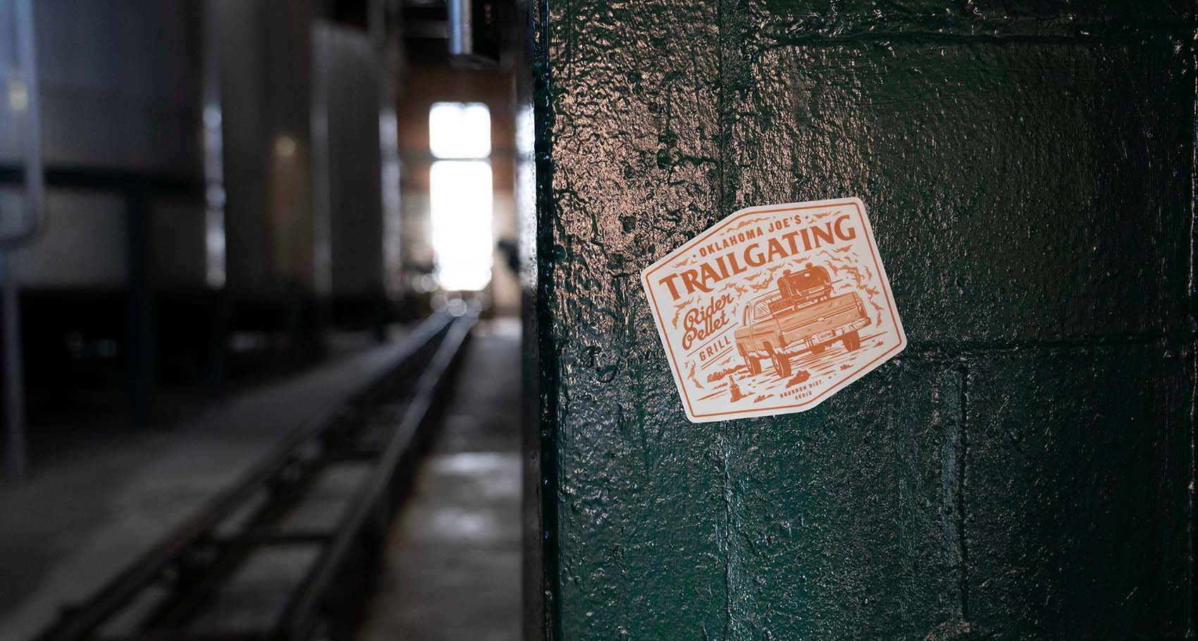Oklahoma Joe's Trailgating sticker on wall in Buffalo Trace Distillery